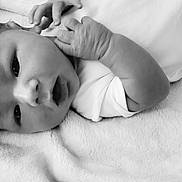 Ryder joined the competition — help win amazing prizes! baby, black_and_white, blanket, clothing, cute, expression, face, hand, head, indoors, infant, lying_down, newborn, peaceful, portrait, skin, sleepwear, soft_texture, toddler, young_child