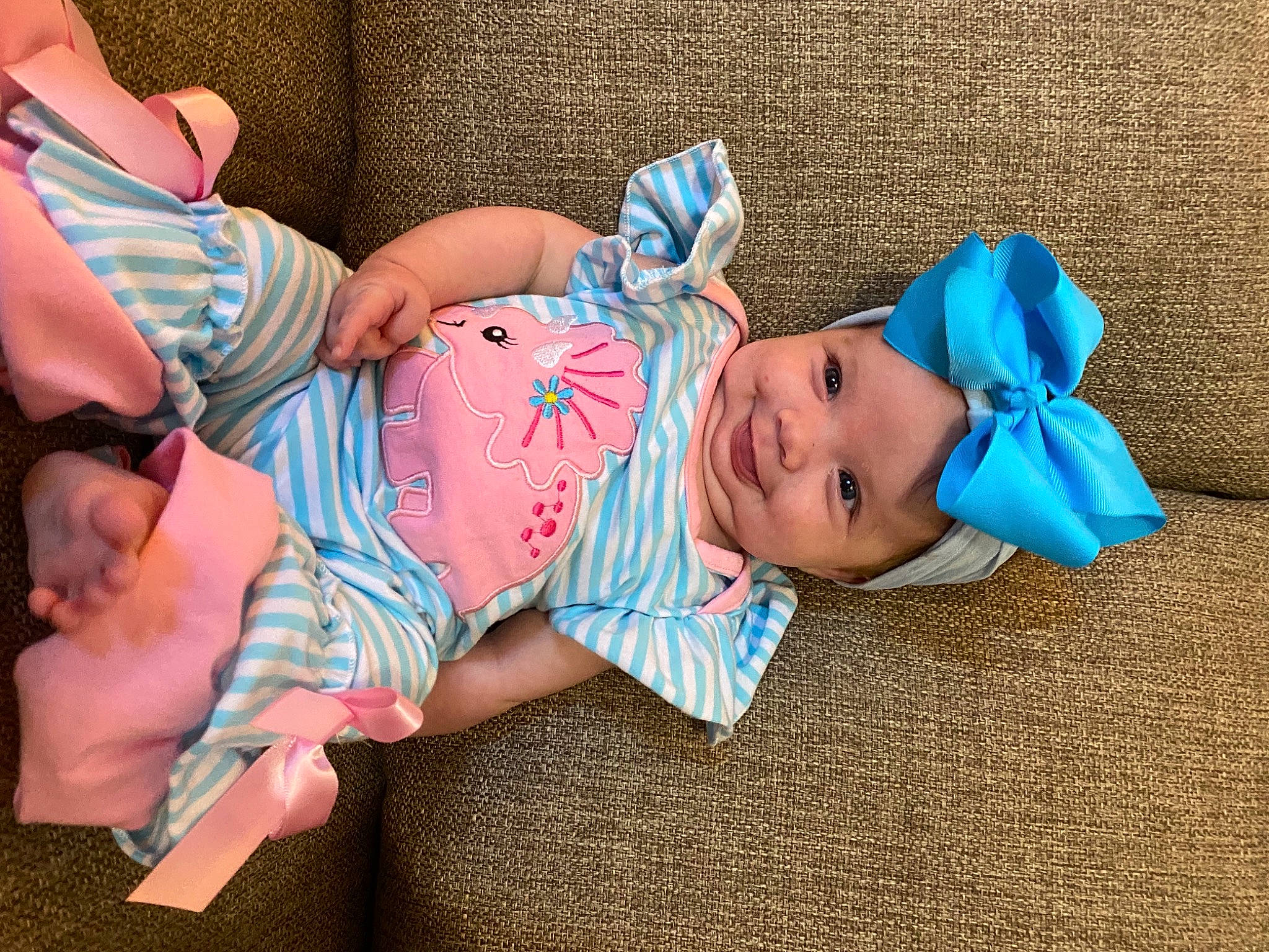 Mckinlee is registered to the contest to win money with this photo: baby, baby_toddler_clothing, child, comfort, fashion_accessory, foot, fun, glasses, hat, headwear, human_body, human_leg, leg, pattern, person, pink, sitting, skin, sock, sunglasses