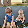 child, children, trampoline, outdoor, grass, summer, play, purple_hair, casual_clothing, blue_shirt, skirt, barefoot, fun, backyard, daylight, two_kids, playground, happy, relaxed, person