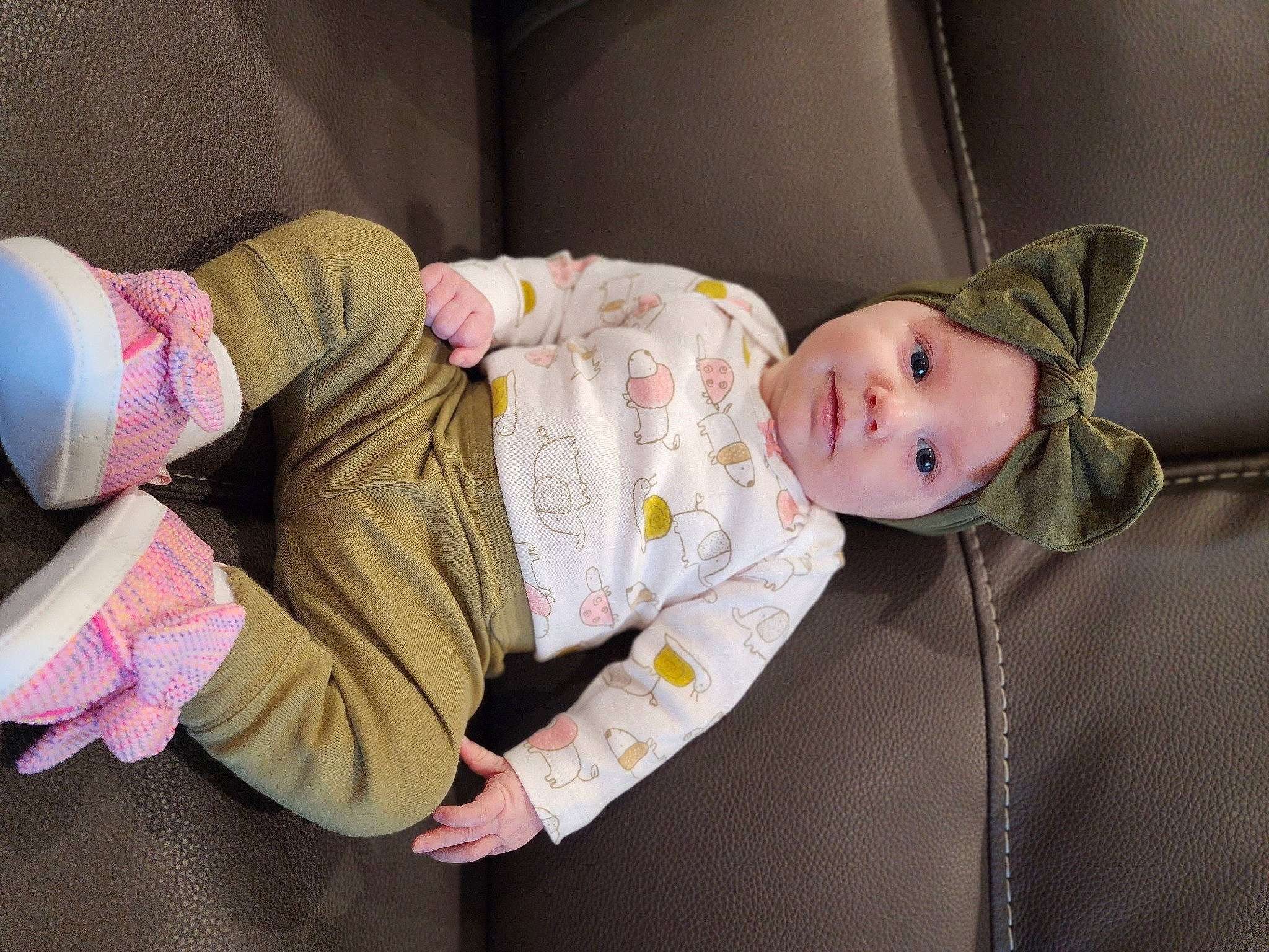 Lenora is registered to the contest to win money with this photo: baby, baby_products, baby_safety, baby_toddler_clothing, cheek, child, clothing, comfort, fur, headgear, headwear, linens, nightwear, pattern, person, pink, product, room, sitting, skin