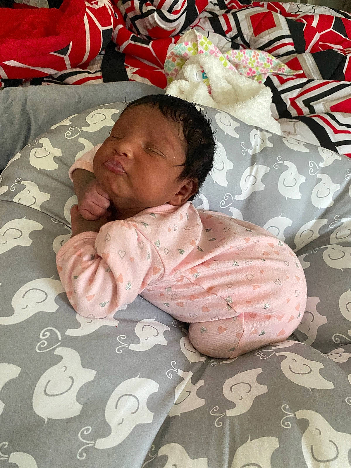 Omarra joined the competition — help win amazing prizes! baby, baby_products, baby_safety, baby_sleeping, baby_toddler_clothing, bed, bed_sheet, bedding, cheek, comfort, face, infant_bed, linens, pattern, person, pink, product, skin, sleeve, textile