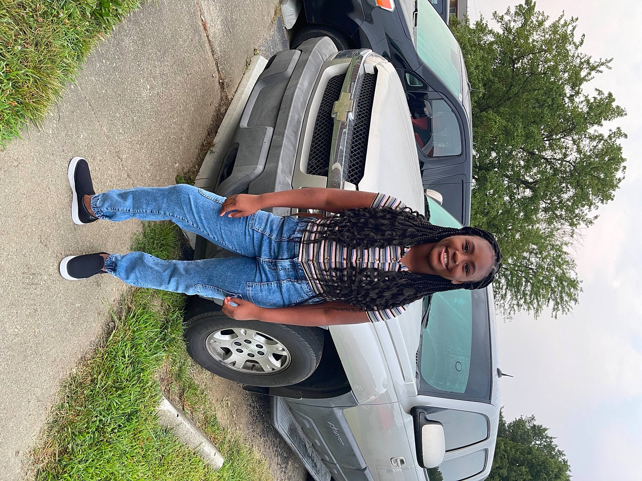 Geniya is registered to the contest to win money with this photo: automotive_design, automotive_exterior, automotive_tire, automotive_wheel_system, car, cloud, green, hood, jeans, joy, land_vehicle, leg, light, motor_vehicle, person, photograph, sky, tire, tree, vehicle