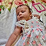 Brooklyn joined the competition — help win amazing prizes! baby, infant, child, dress, floral_pattern, blanket, laying_down, cute, soft_texture, pink_flowers, white_dress, portrait, young_child, sleepwear, resting, indoors, human, skin, head, arm