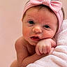 Brooklyn is registered to the contest to win money with this photo: baby, infant, pink_headband, bow, blanket, soft_texture, close_up, cute, face, skin, hand, resting, expression, newborn, portrait, child, adorable, curious, indoor, warm_colors