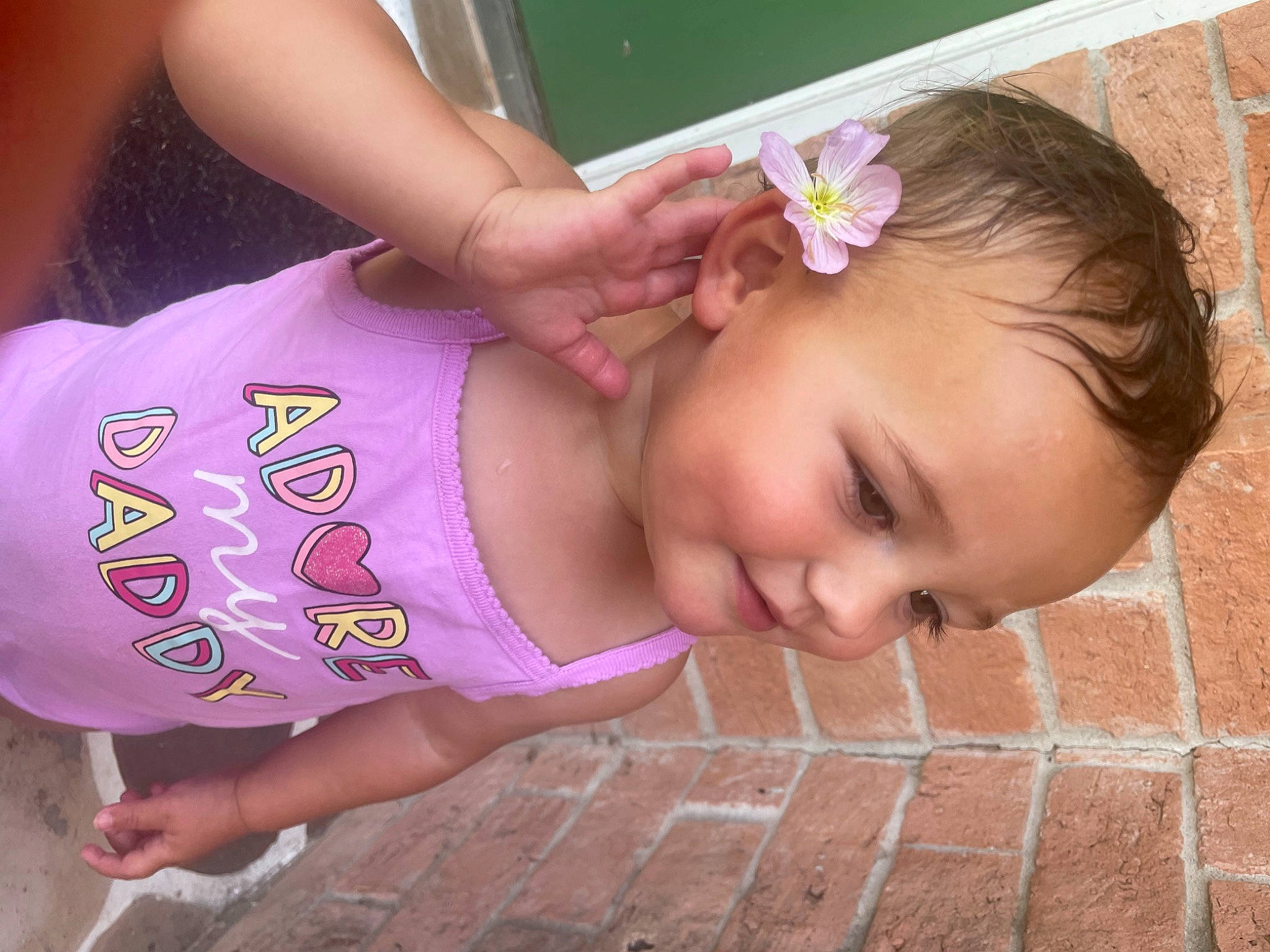 Senua is registered to the contest to win money with this photo: baby, baby_toddler_clothing, cheek, chin, eye, eyelash, flower, hair, hairstyle, happy, human, lip, mouth, neck, nose, person, pink, skin, smile, toddler