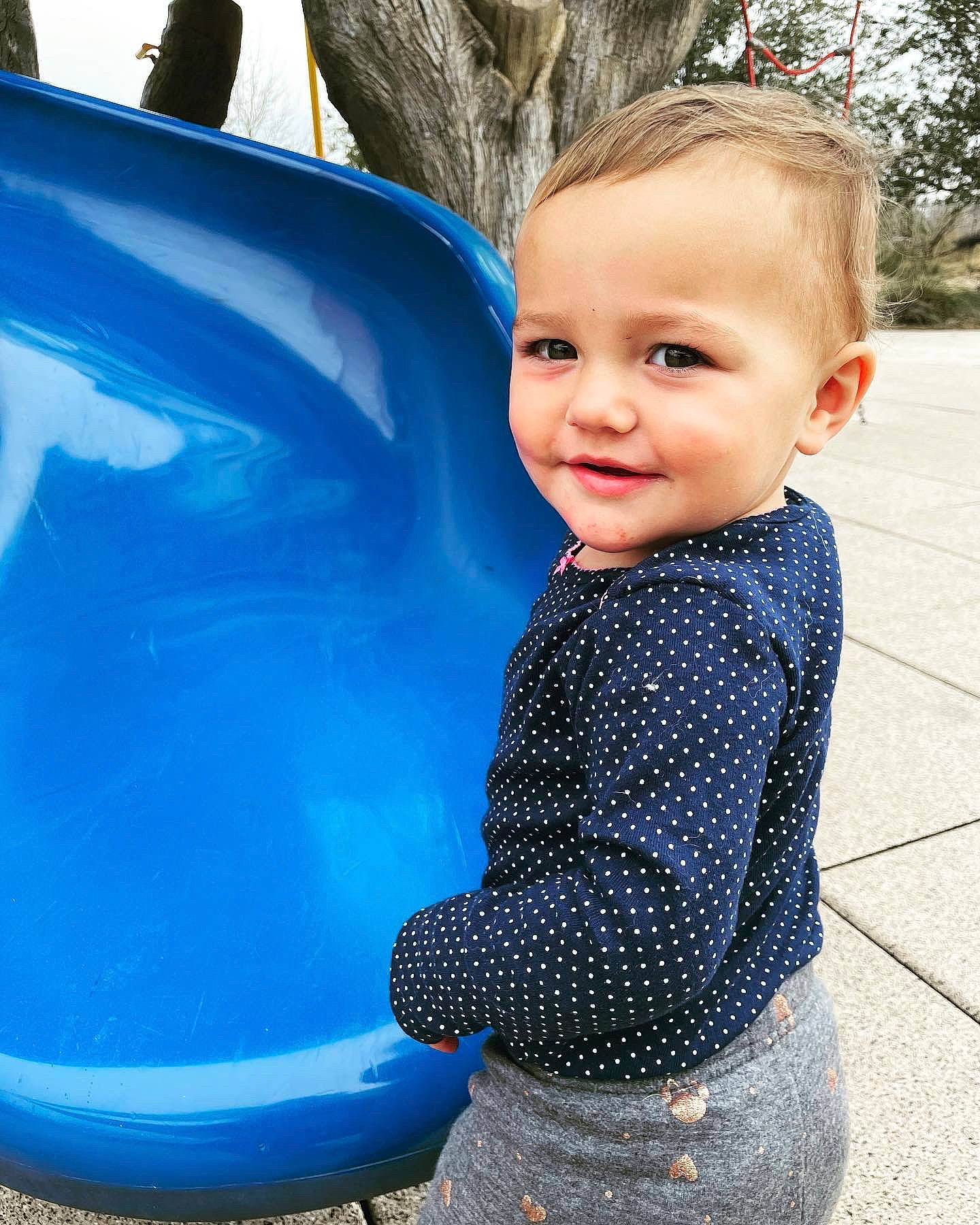 Senua is registered to the contest to win money with this photo: azure, baby, baby_toddler_clothing, blue, cool, electric_blue, eye, fun, grass, hairstyle, happy, head, human_body, joy, leisure, person, recreation, sleeve, smile, t_shirt