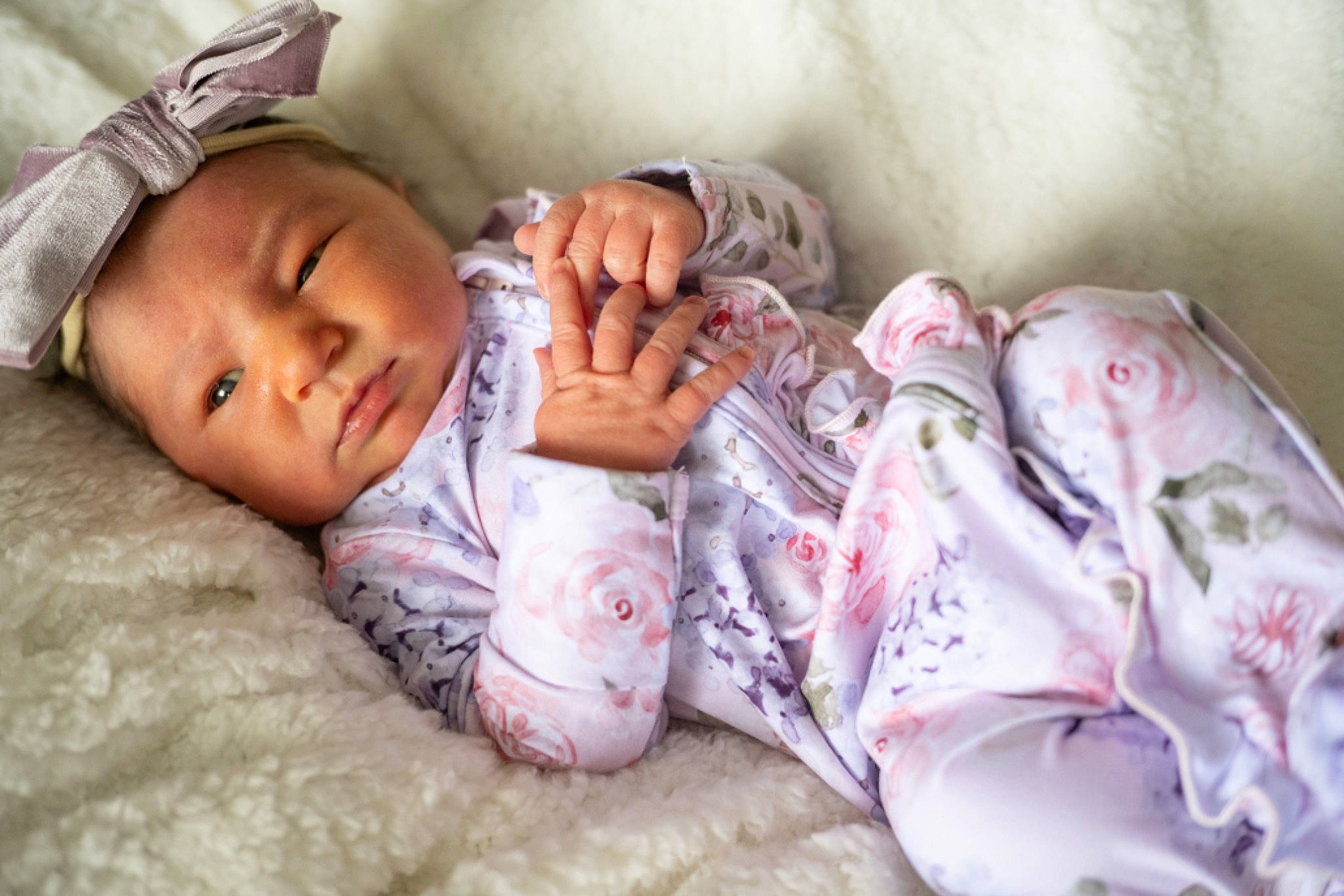 Oaklee is registered to the contest to win money with this photo: arm, baby, baby_sleeping, baby_toddler_clothing, bedding, bedtime, comfort, eye, face, finger, fur, grass, hair, hand, happy, human_body, linens, person, pink, skin