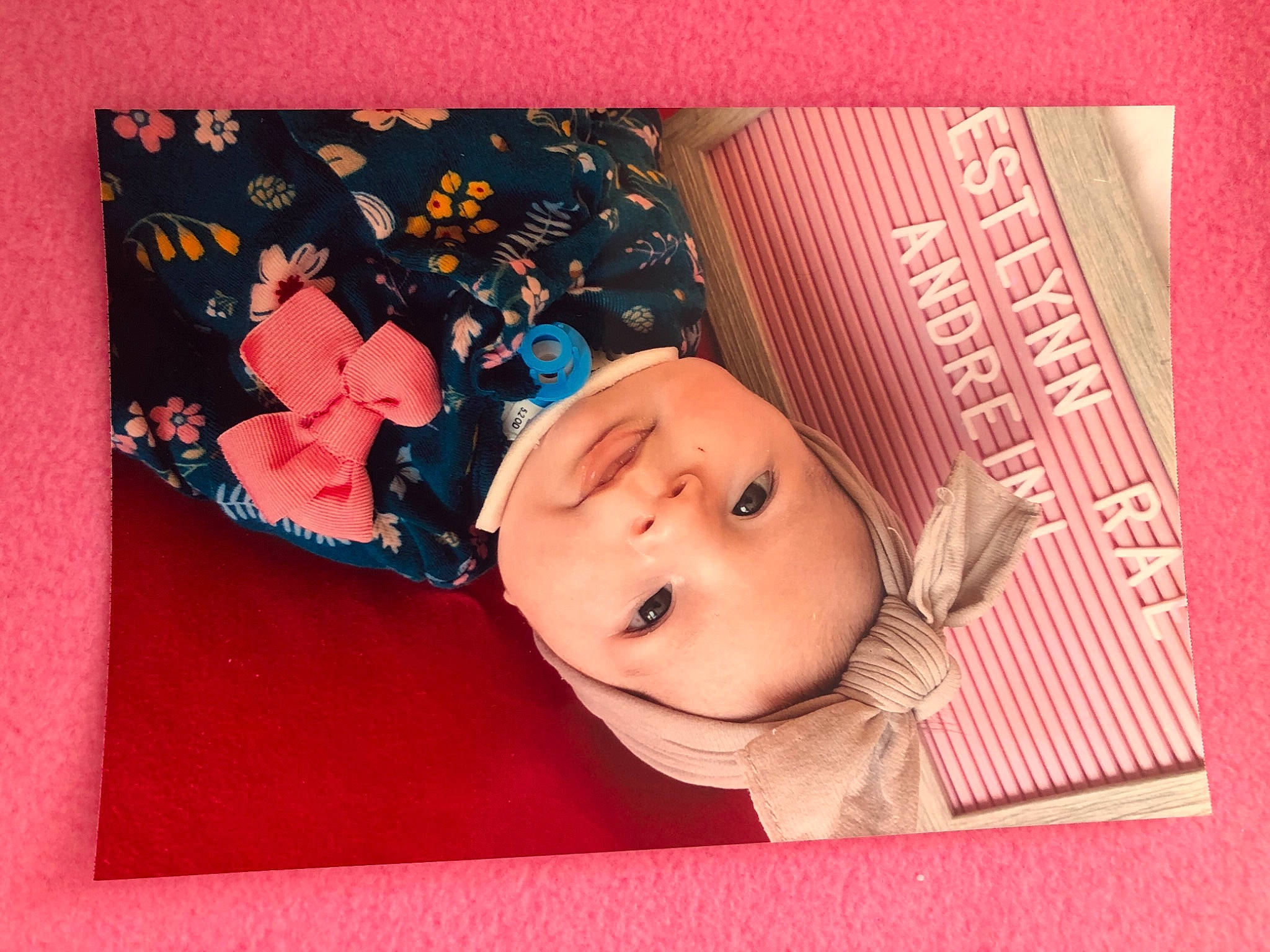 Westlynn is registered to the contest to win money with this photo: baby, baby_toddler_clothing, banknote, cheek, child, collectable, eyelash, fashion_accessory, font, happy, headwear, magenta, material_property, paper, paper_product, pattern, person, pink, rectangle, room
