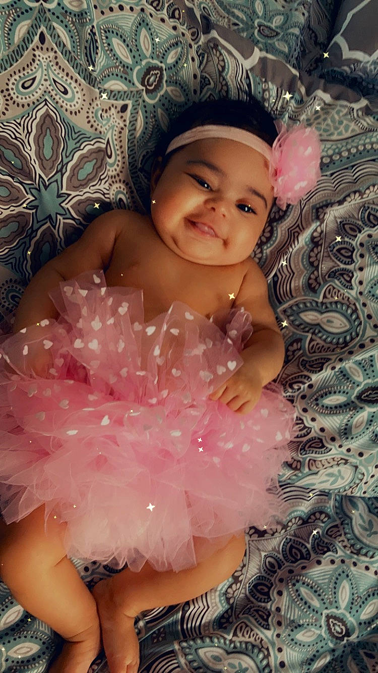 Alivia is registered to the contest to win money with this photo: baby, baby_toddler_clothing, child, embellishment, event, fashion_accessory, flash_photography, fun, hair_accessory, happy, headgear, headpiece, headwear, iris, joy, magenta, pattern, person, pink, skin