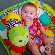 Nellie is registered to the contest to win money with this photo: baby, ball, blanket, cushion, doll, face, football, furniture, happy, head, homedecor, person, photography, pillow, portrait, quilt, soccer, soccerball, sport, toy