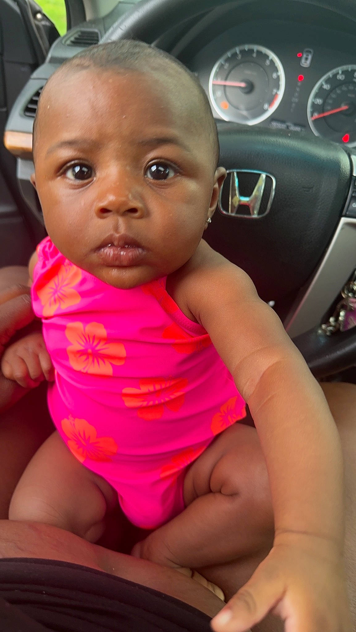 Dazlyn is registered to the contest to win money with this photo: baby, car, child, eyelash, finger, gauge, happy, lip, mouth, nail, person, personal_luxury_car, skin, speedometer, steering_wheel, thigh, thumb, toddler, trunk, vehicle_door