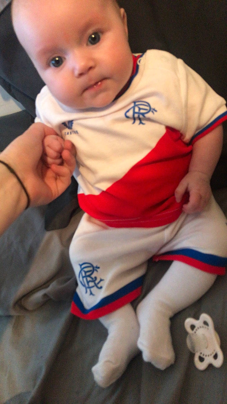 Mckenzie joined the competition — help win amazing prizes! baby, blanket, bodypart, clothing, couch, cushion, dress, face, finger, furniture, hand, head, homedecor, newborn, person, photography, portrait, shirt, sitting, t_shirt