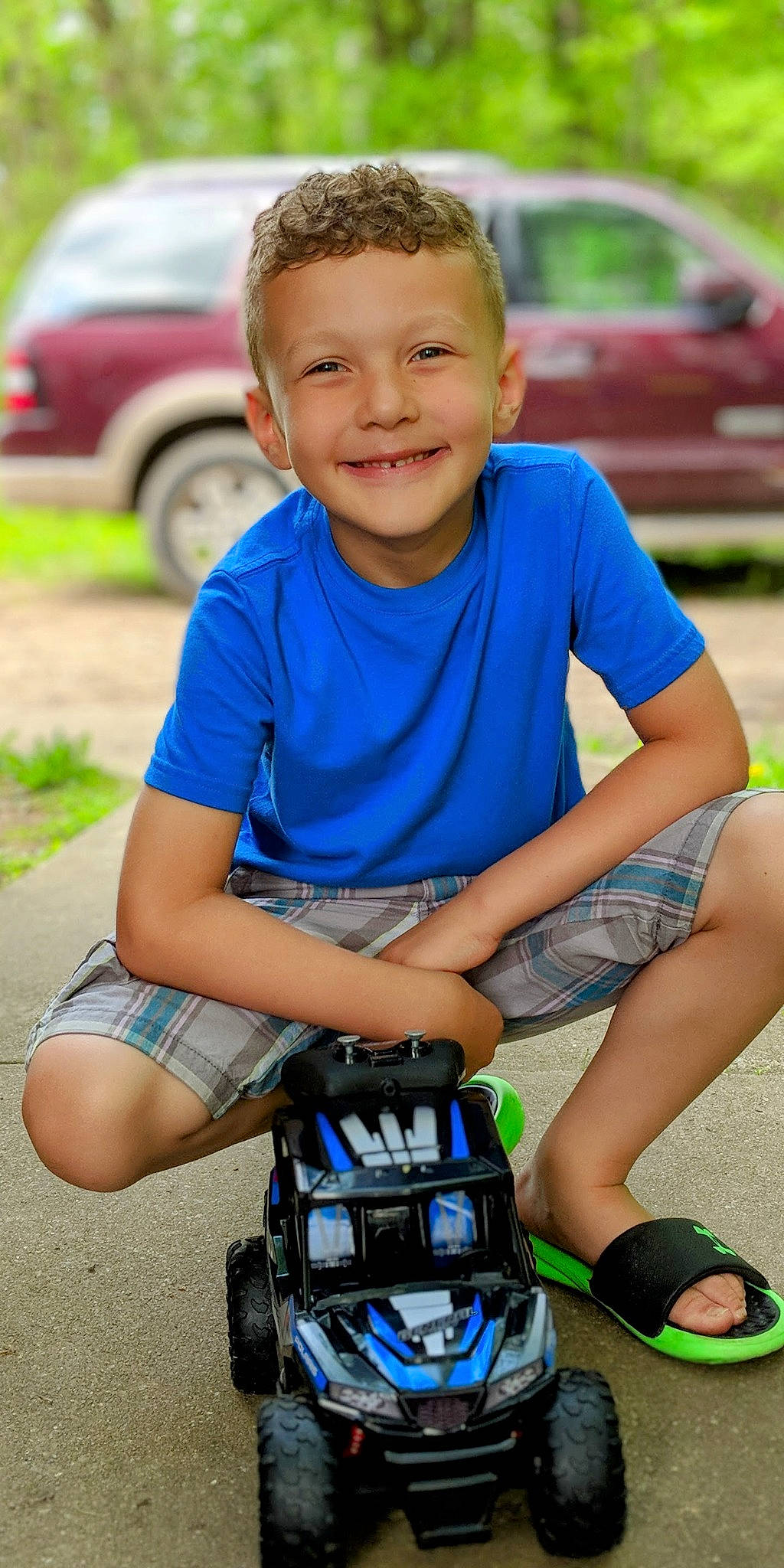 Jaydon joined the competition — help win amazing prizes! automotive_tire, blue, car, electric_blue, grass, happy, joy, land_vehicle, leisure, motor_vehicle, person, photograph, plant, shoe, shorts, smile, sneakers, summer, t_shirt, tire