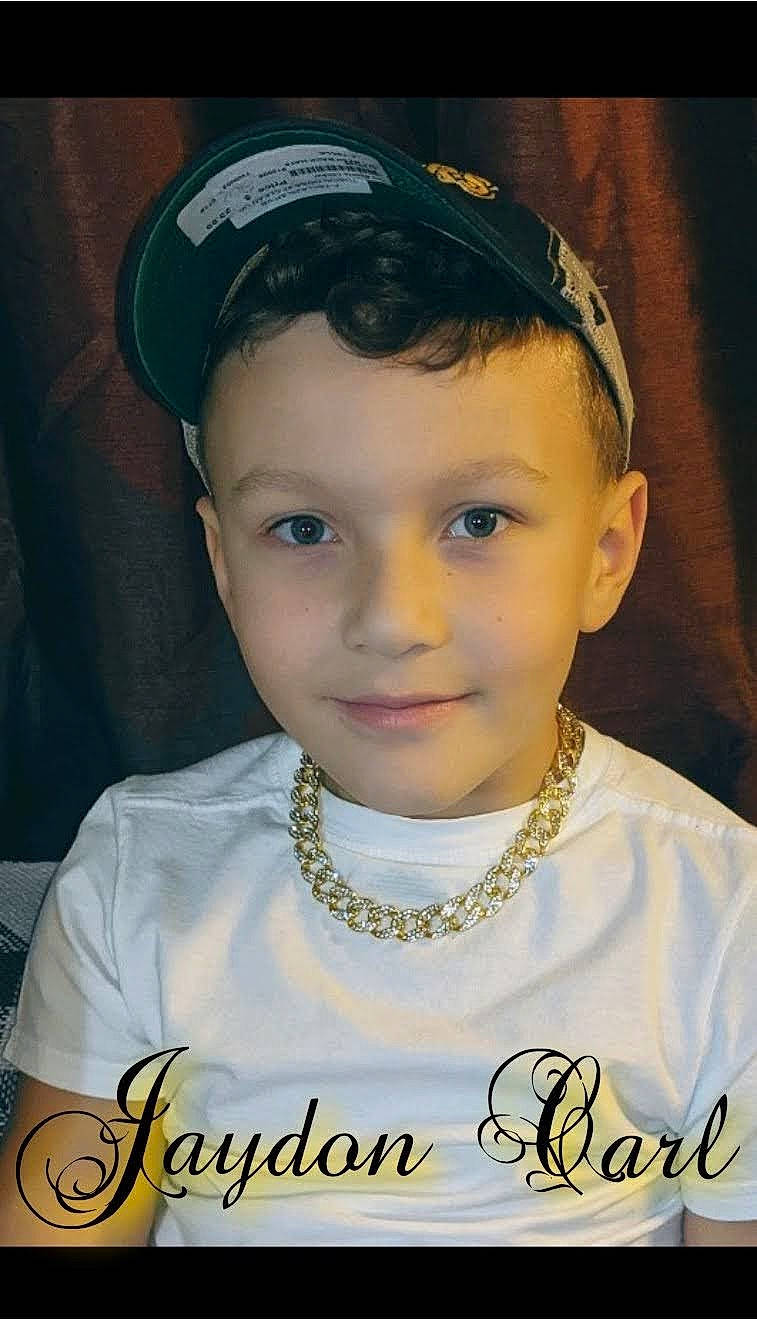 Jaydon is registered to the contest to win money with this photo: black_hair, cheek, chin, eyebrow, eyelash, flash_photography, forehead, hairstyle, happy, head, headgear, iris, joy, lip, neck, nose, person, skin, sleeve, smile