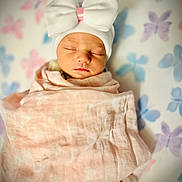 Reese is registered to the contest to win money with this photo: newborn, baby, sleeping, hat, bow, blanket, pink, white, soft, cozy, butterfly, pattern, infant, cute, portrait, sleep, child, toddler, wrapped, peaceful
