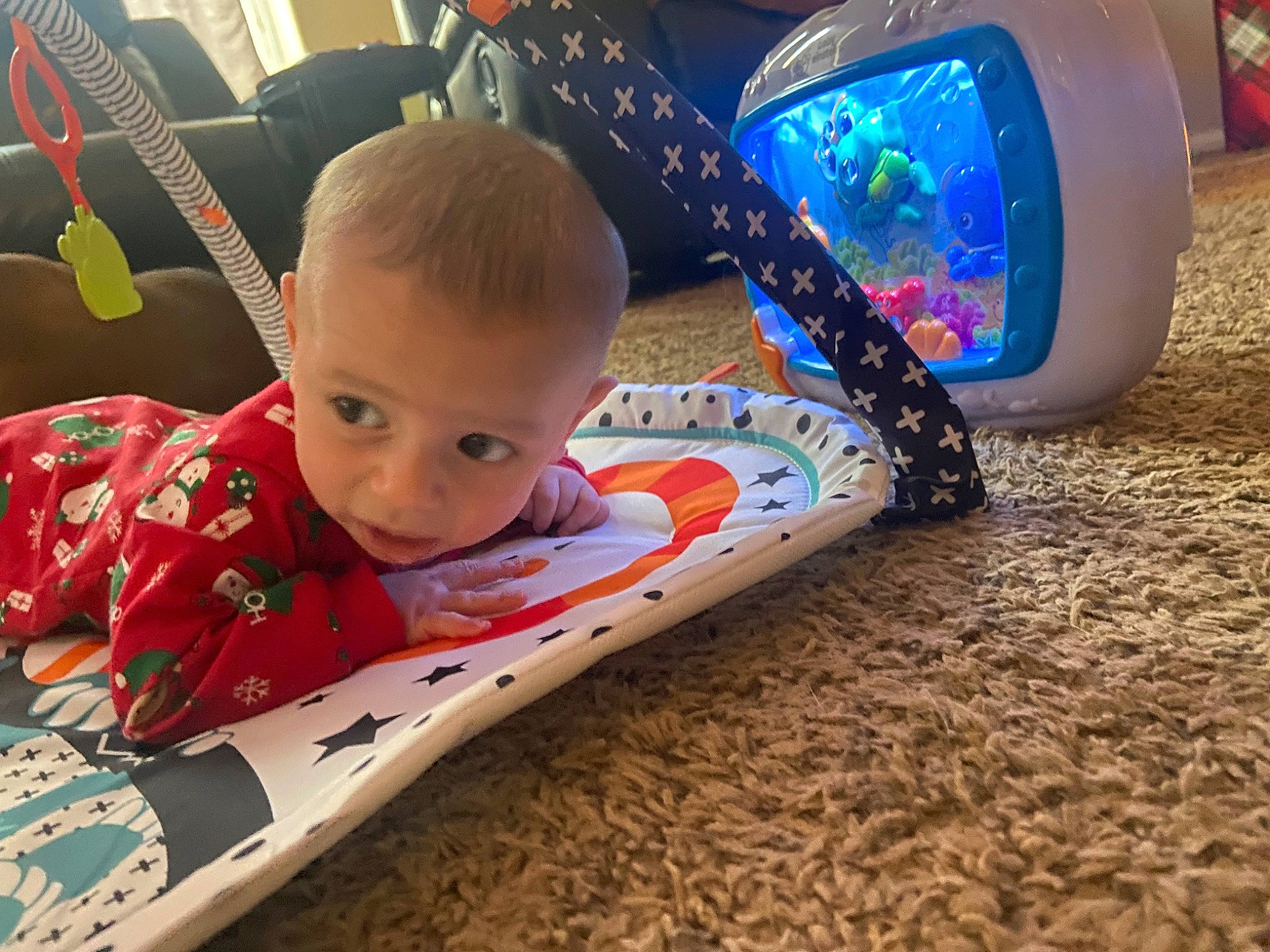 Leonardo is registered to the contest to win money with this photo: baby, carmine, child, comfort, electric_blue, flooring, fun, happy, helmet, home_appliance, leisure, person, personal_protective_equipment, play, product, sitting, smile, sports_gear, t_shirt, toddler
