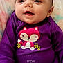 Eleanor is registered to the contest to win money with this photo: applique, baby, clothing, cushion, face, happy, head, homedecor, newborn, pants, pattern, person, photography, portrait, purple, quilt, shirt, sitting, smile, t_shirt