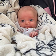 Eleanor is registered to the contest to win money with this photo: baby, bed, blanket, bonnet, cradle, crib, cushion, face, furniture, head, homedecor, infantbed, linen, newborn, person, photography, portrait, quilt, sleeping, towel