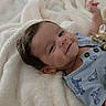 éden joined the competition — help win amazing prizes! baby, barefoot, bed, blanket, blue_outfit, child, close_up, cozy, dark_hair, face, fluffy_blanket, happy, home, indoor, infant, lying_down, pacifier, portrait, raised_foot, smiling