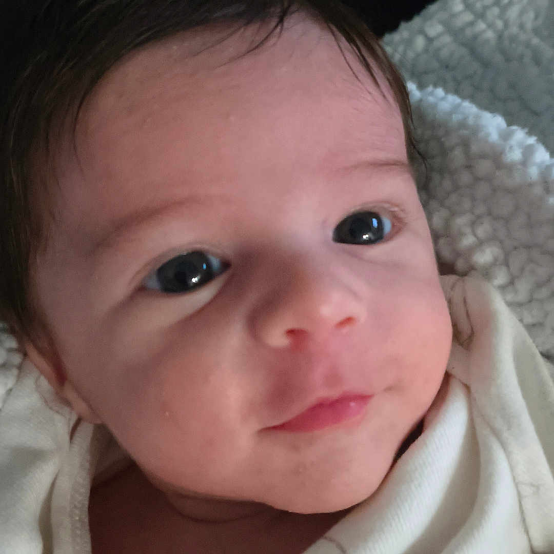 éden joined the competition — help win amazing prizes! baby, infant, face, portrait, closeup, eyes, blanket, newborn, skin, cute, child, young, person, clothing, soft, indoors, expression, head, human, warm