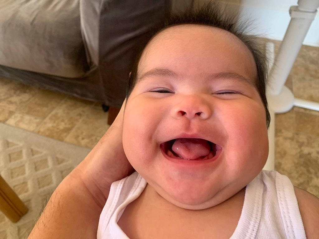 Jeannie joined the competition — help win amazing prizes! baby, cheek, chin, comfort, ear, face, facial_expression, finger, gesture, happy, headwear, iris, jaw, joy, lip, mouth, nose, person, skin, smile