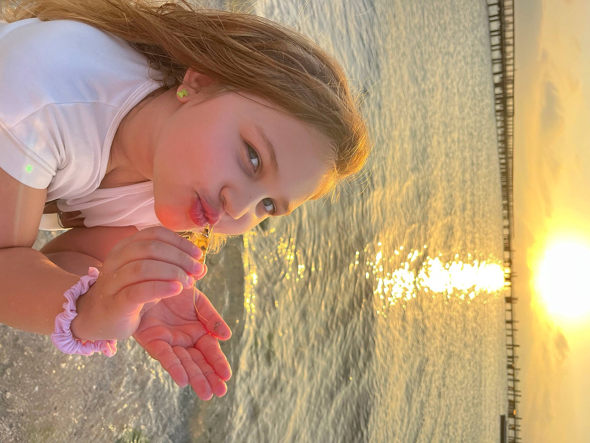 Mia-rose is registered to the contest to win money with this photo: beach, body_of_water, child, eye, flash_photography, fun, hair, happy, lake, leisure, lip, long_hair, people_in_nature, person, sand, skin, sky, smile, sunlight, water