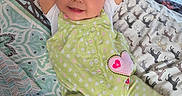 Mariana joined the competition — help win amazing prizes! arms_up, baby, bed, big_eyes, blanket, cute, green_outfit, happy, heart_patch, infant, legs_motion_blur, lying_down, monitor, nursery, pillow, plush_toy, polka_dot, portrait, rosy_cheeks, smile
