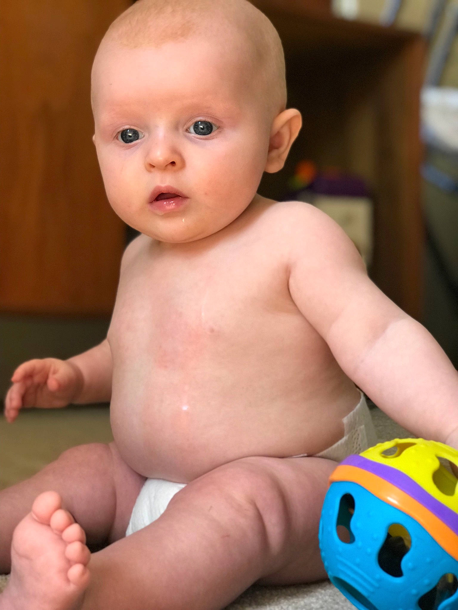 Timmy joined the competition — help win amazing prizes! baby, baby_products, cheek, child, face, head, joint, muscle, person, sitting, skin, toddler, toy, tummy_time