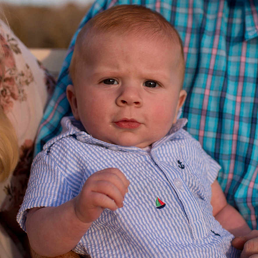 Callum joined the competition — help win amazing prizes! baby, bodypart, clothing, couch, cushion, face, finger, frown, furniture, hand, head, homedecor, newborn, pants, person, photography, portrait, sad, shirt, text