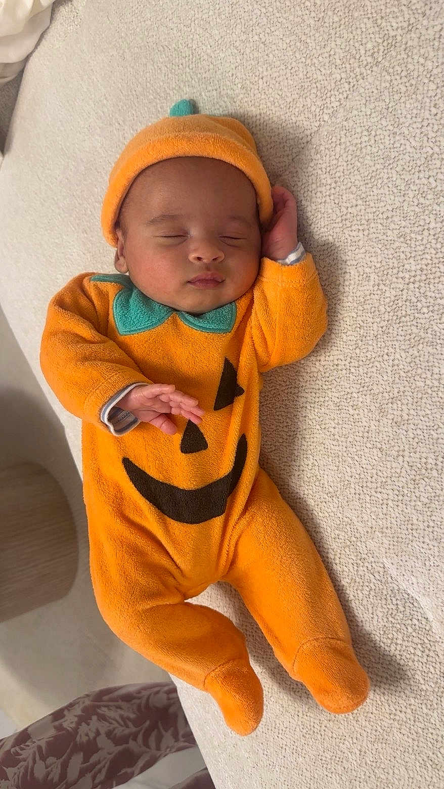 Ayden participe au concours pour gagner de l'argent avec cette photo : baby, infant, sleeping, pumpkin_costume, orange_clothing, hat, cute, child, costume, face, hand, footed_pajamas, indoors, resting, soft_texture, cozy, lying_down, peaceful, young_child, portrait