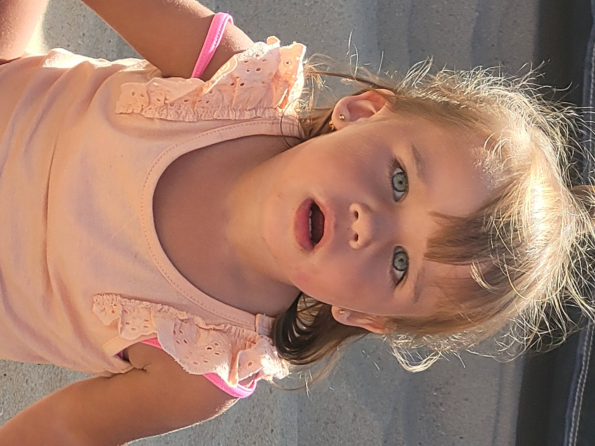 Mya participe au concours pour gagner de l'argent avec cette photo : brown_hair, cheek, chest, child, eyebrow, eyelash, fashion_design, flash_photography, fun, happy, iris, lip, long_hair, mouth, nose, peach, person, pink, skin, toddler