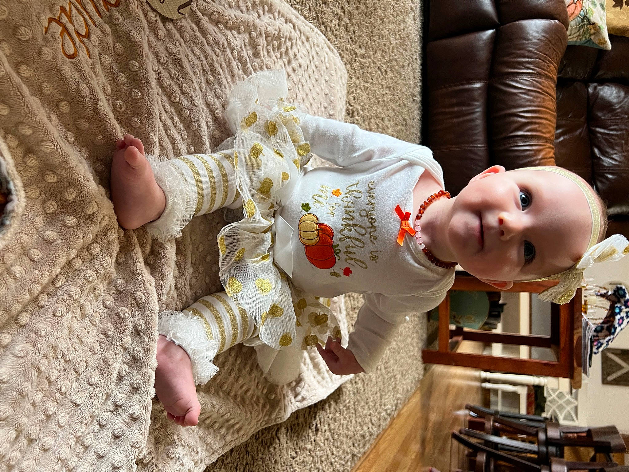 Jayde is registered to the contest to win money with this photo: baby, baby_toddler_clothing, chair, child, doll, flooring, fun, happy, hat, human_body, joy, linens, pattern, person, plant, room, sitting, smile, toddler, toy