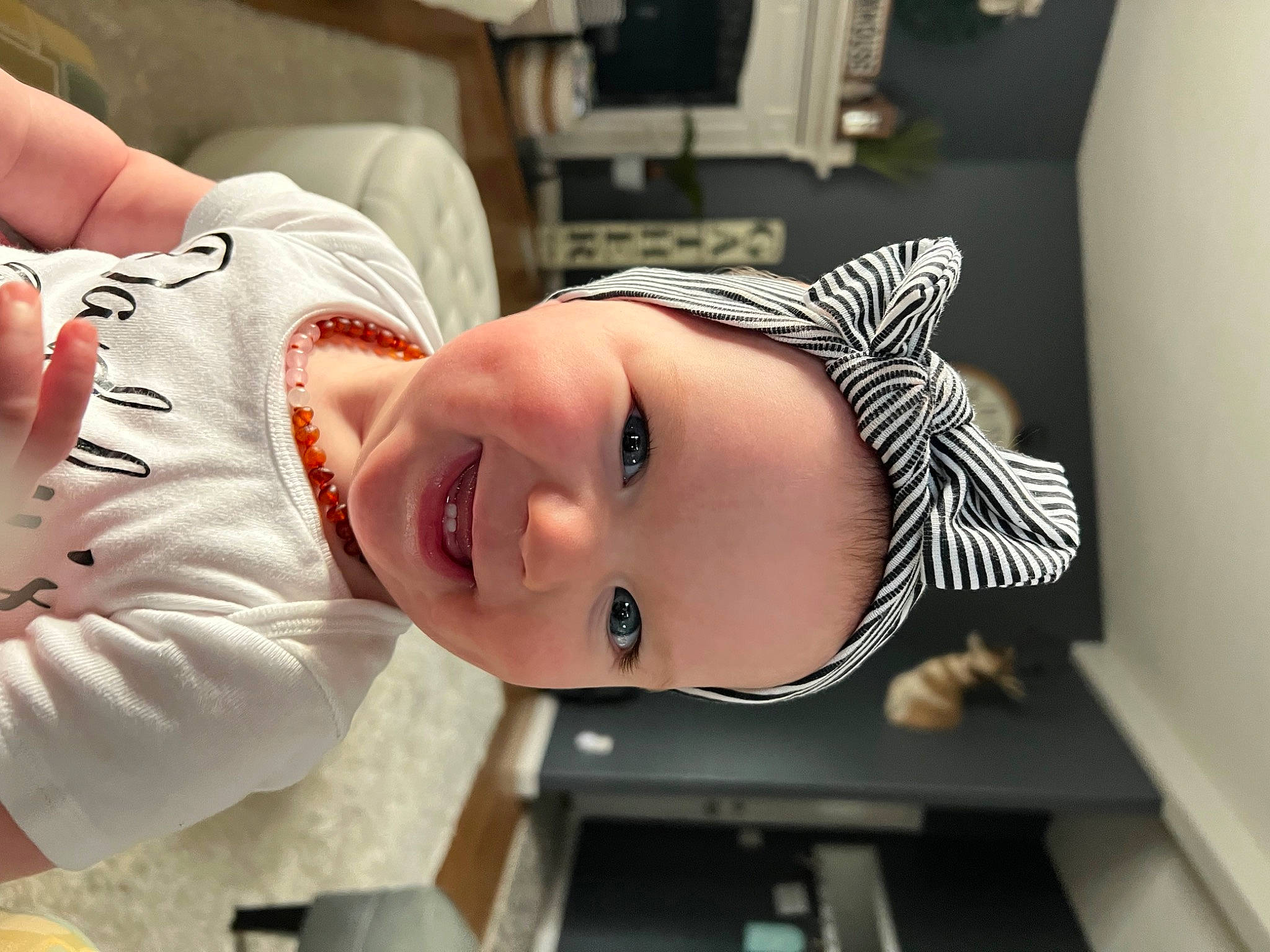 Jayde is registered to the contest to win money with this photo: baby, baby_toddler_clothing, cheek, child, chin, elbow, eye, eyebrow, eyelash, happy, hat, headwear, jaw, joy, lip, mouth, neck, nose, person, room