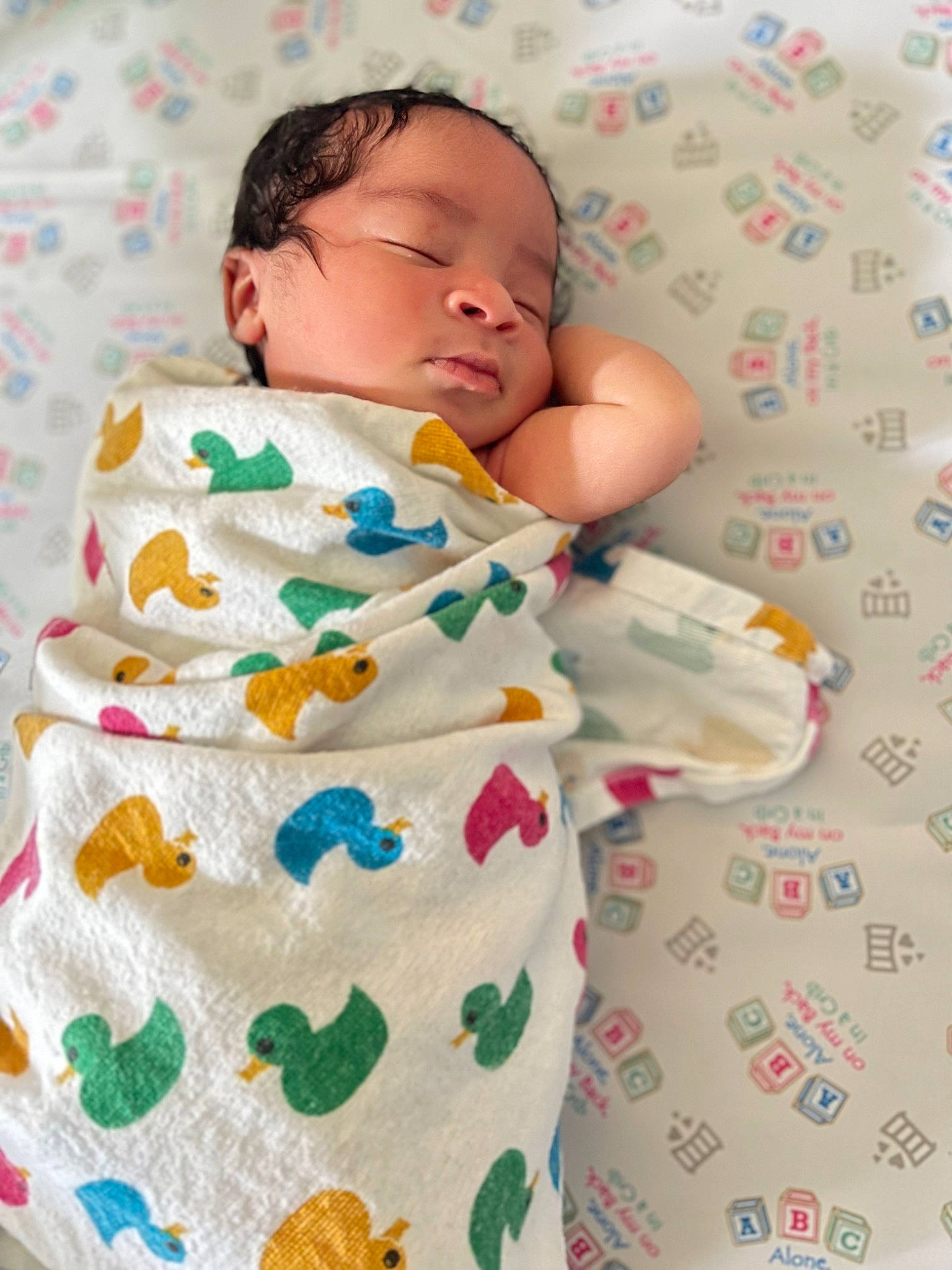 Devon is registered to the contest to win money with this photo: baby, baby_products, baby_sleeping, baby_toddler_clothing, bed_sheet, bedding, bedtime, blanket, child, comfort, face, linens, pattern, person, room, skin, sleep, sleeve, textile, toddler