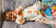 Ahyann-Mathïs a rejoint le concours — aidez-le/la à gagner de superbes lots ! baby, bed, bedroom, blanket, clothing, couch, crib, cushion, dress, face, furniture, head, homedecor, indoors, infantbed, person, photography, portrait, quilt, room