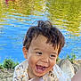 Ahyann-Mathïs a rejoint le concours — aidez-le/la à gagner de superbes lots ! boats, casual, child, clothing, face, grass, hair, happy, joyful, lake, nature, outdoor, paddle, person, playful, smiling, summer, sunlight, toddler, water