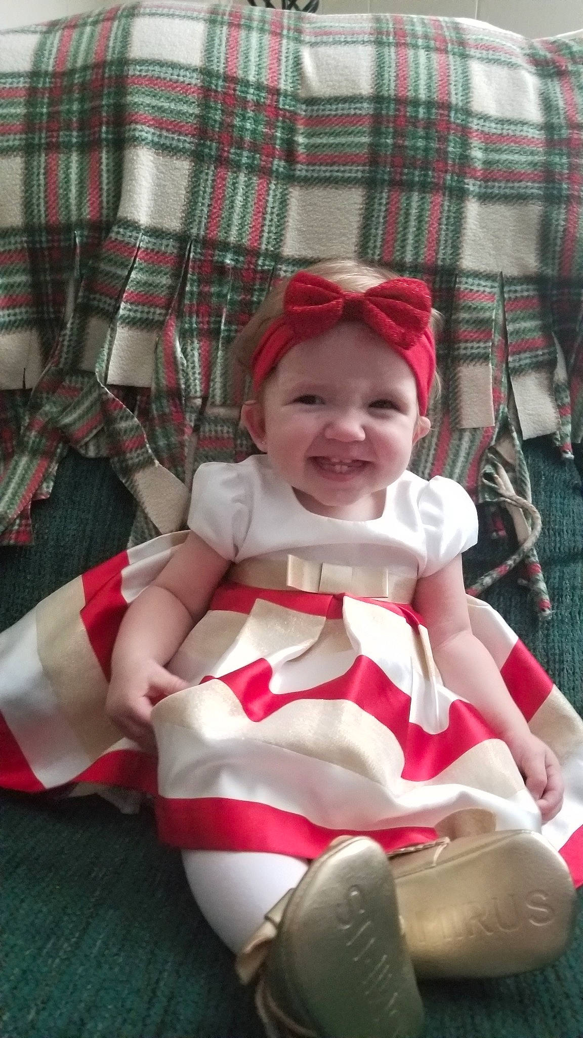 Emma Rose is registered to the contest to win money with this photo: baby, child, joy, leg, pattern, person, smile, tartan, textile, toddler