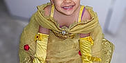 Ayline a rejoint le concours — aidez-le/la à gagner de superbes lots ! child, princess, crown, yellow_dress, gloves, smiling, indoor, happy, face, costume, playful, footwear, shoe, fashion, portrait, cute, young, celebration, dress_up, fun