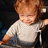 Damien is registered to the contest to win money with this photo: toddler, child, red_hair, curly_hair, smiling, grinning, face, portrait, stroller, seated, outdoor, sunlight, checkered_shirt, clothing, toy, plush_toy, baby, young_child, happy, photography