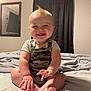 baby, infant, smile, camo_overalls, bed, bedroom, mirror, curtains, happy, child, person, feet, hands, toes, short_hair, indoor, light, cute, sitting, portrait