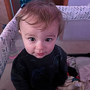 Jasper is registered to the contest to win money with this photo: baby, blanket, child, clothing, curious, cute, expression, eyes, face, floor, hair, home, indoor, person, playpen, portrait, smile, toddler, toy, young