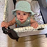 Jasper joined the competition — help win amazing prizes! baby, baby_toys, blanket, carpet, child, curious, cute, face, grip, hands, hat, home, indoor, infant, looking_up, person, playpen, soft_lighting, striped_clothing, young_child