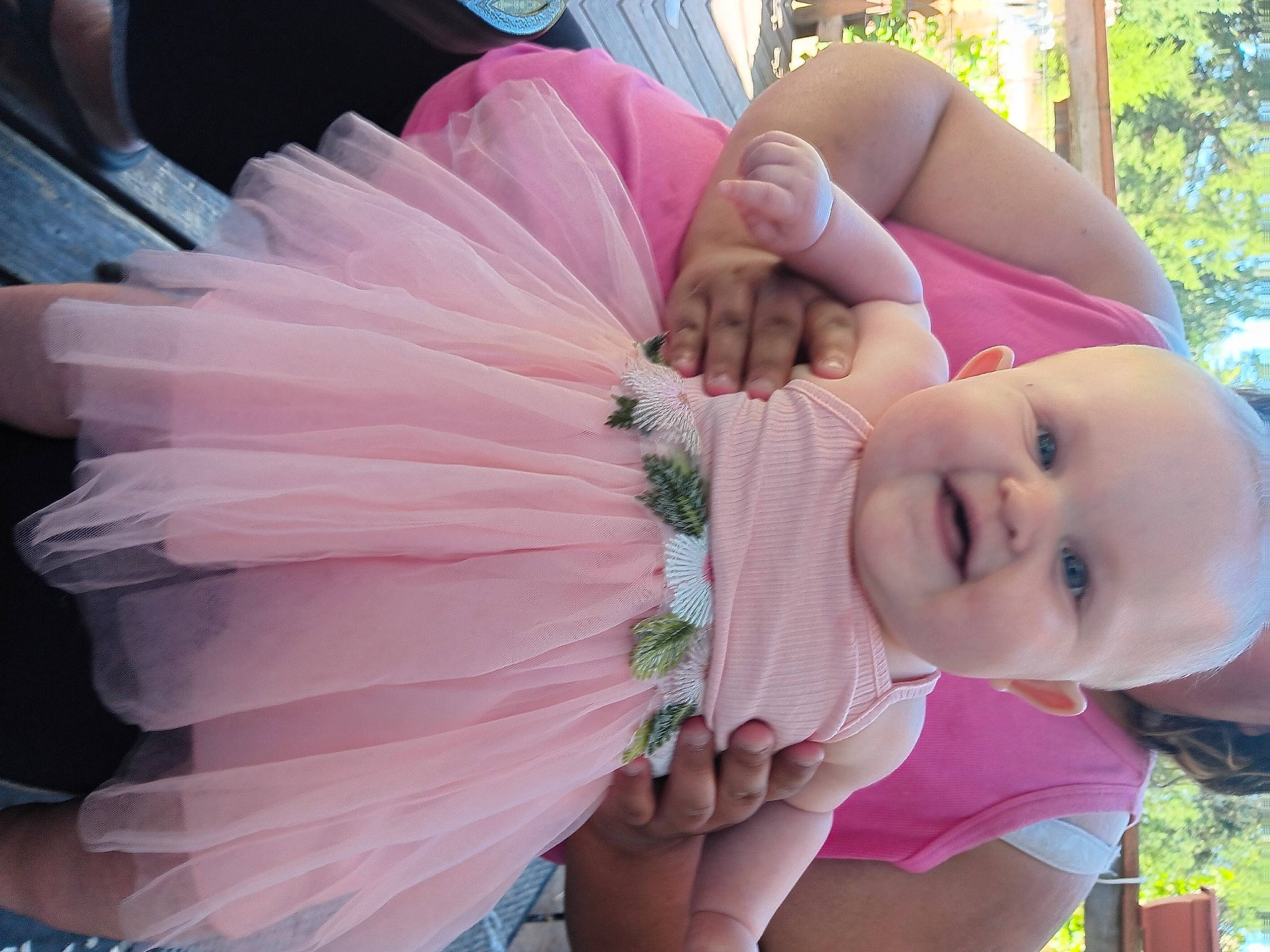 Naomi is registered to the contest to win money with this photo: baby, baby_toddler_clothing, bridal_accessory, child, dress, event, fashion_accessory, fun, grass, happy, leisure, magenta, peach, people_in_nature, person, petal, pink, plant, smile, toddler