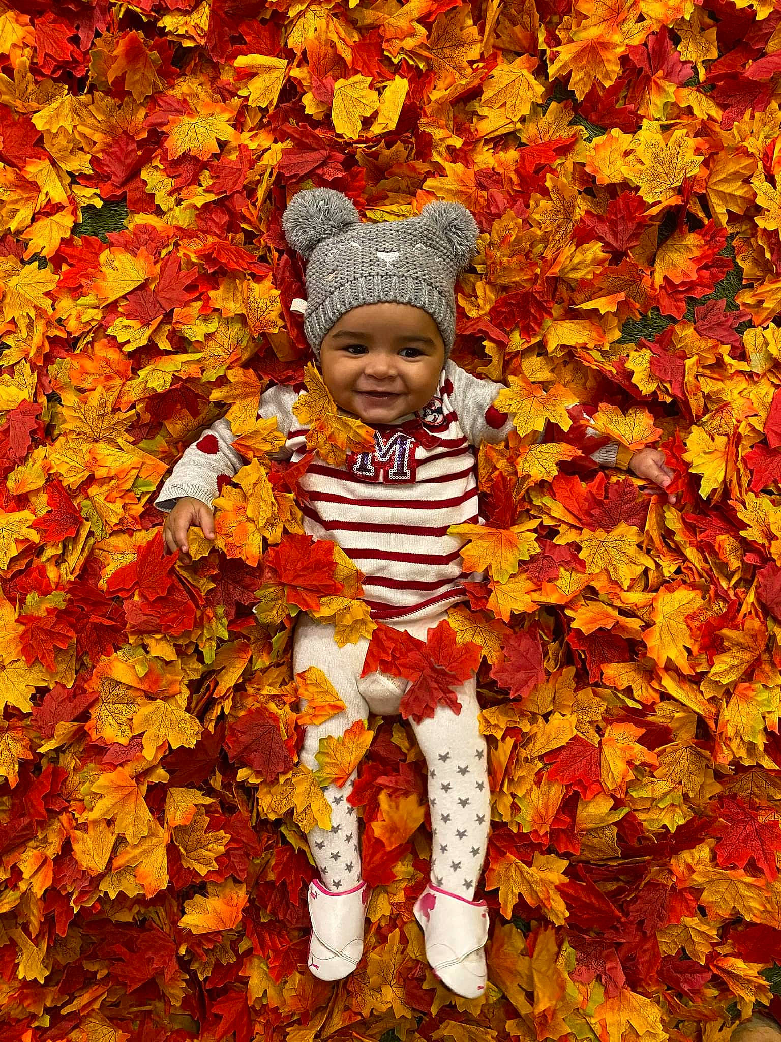 Sofia participe au concours pour gagner de l'argent avec cette photo : autumn, baby, baby_laughing, baby_toddler_clothing, beauty, deciduous, fun, grass, happy, head, headwear, joy, leaf, natural_landscape, nature, orange, people_in_nature, person, smile, tints_and_shades