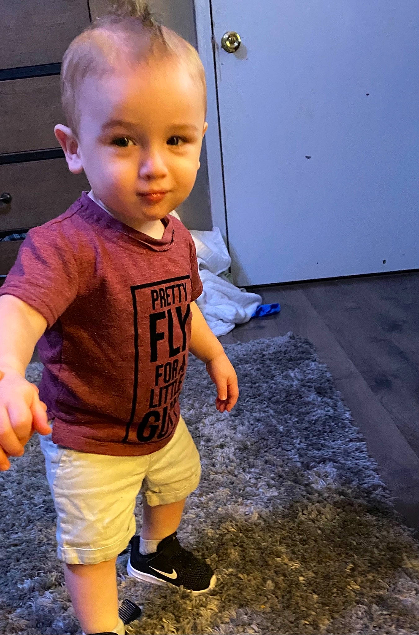 Kaesen is registered to the contest to win money with this photo: baby, cheek, child, head, person, play, smile, standing, t_shirt, toddler