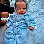 baby, child, snow, winter, blue_onesie, fuzzy_clothing, cute, smile, outdoor, cold_weather, person, infant, hood, ears, snowy_background, happy, warm_clothing, small_hand, sitting, portrait