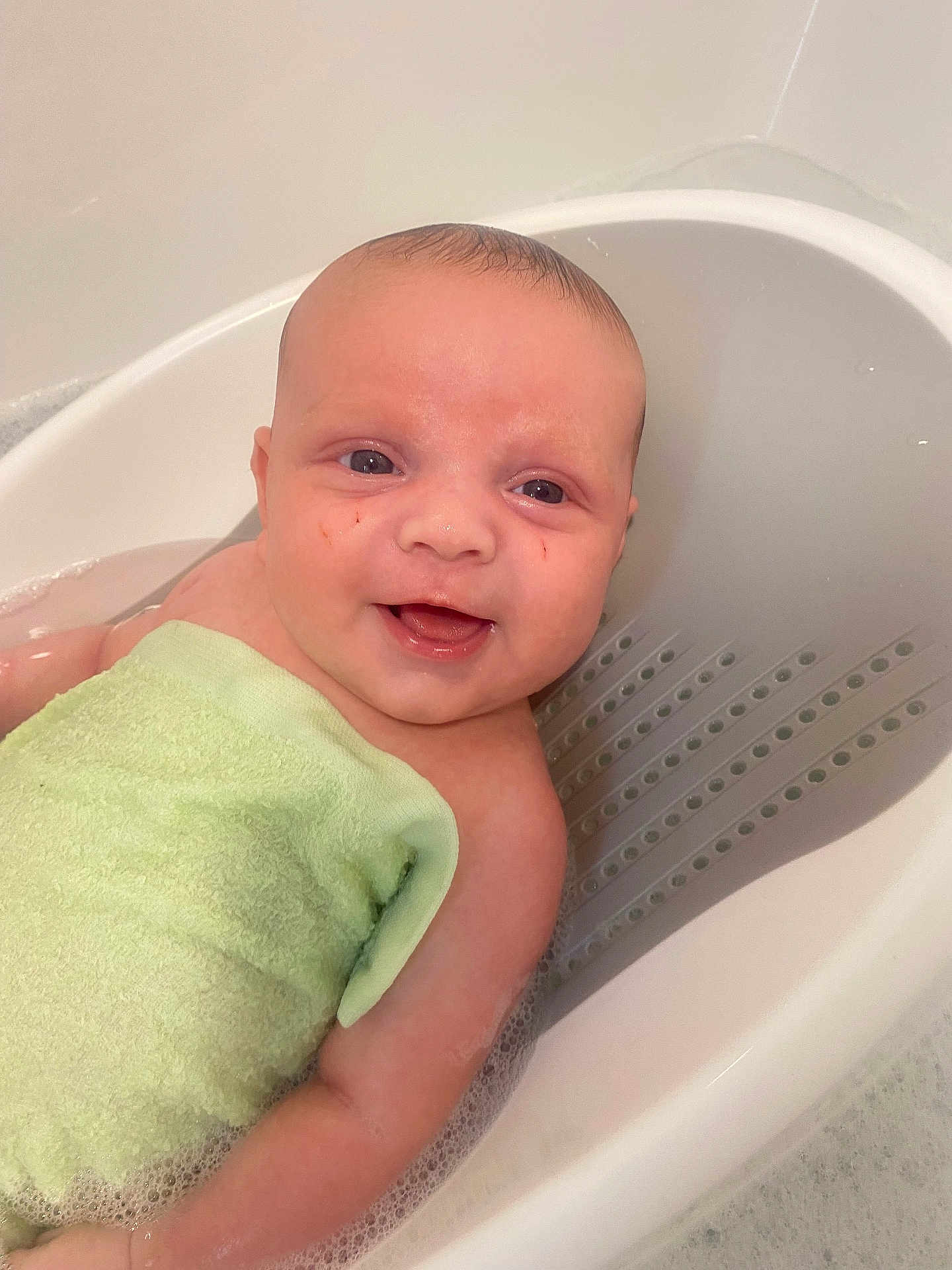 Tommy joined the competition — help win amazing prizes! baby, bathtub, bath, water, towel, smile, child, infant, cute, happy, skin, head, face, foam, bubble, arm, bathroom, young, person, clean