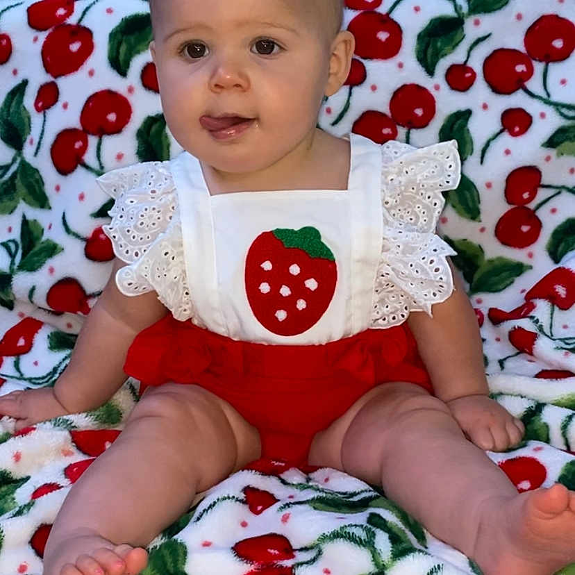 Daisy Mae is registered to the contest to win money with this photo: applique, baby, bed, bedroom, blanket, bodypart, couch, cushion, face, finger, furniture, hand, head, homedecor, pattern, person, photography, portrait, quilt, sitting
