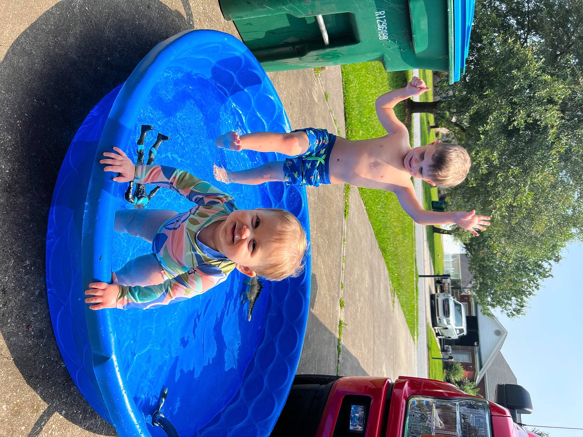 Mckenna joined the competition — help win amazing prizes! arm, auto_part, automotive_exterior, automotive_lighting, automotive_tire, blue, car, electric_blue, fun, green, joy, leisure, motor_vehicle, person, recreation, red, sky, t_shirt, tire, tree