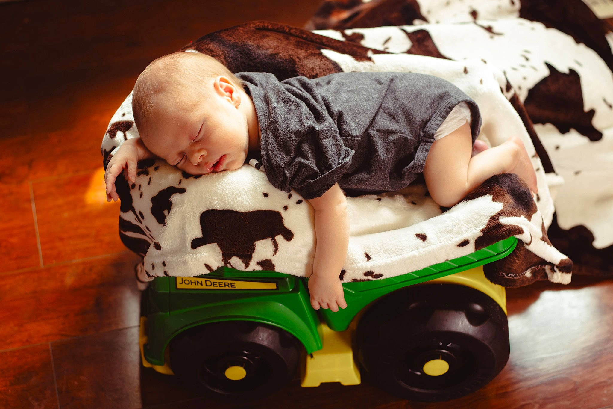 Carson is registered to the contest to win money with this photo: baby, baby_products, baby_safety, baby_sleeping, baby_toddler_clothing, child, comfort, cool, flooring, fun, grass, happy, person, product, riding_toy, tire, toddler, toy, toy_vehicle, wheel
